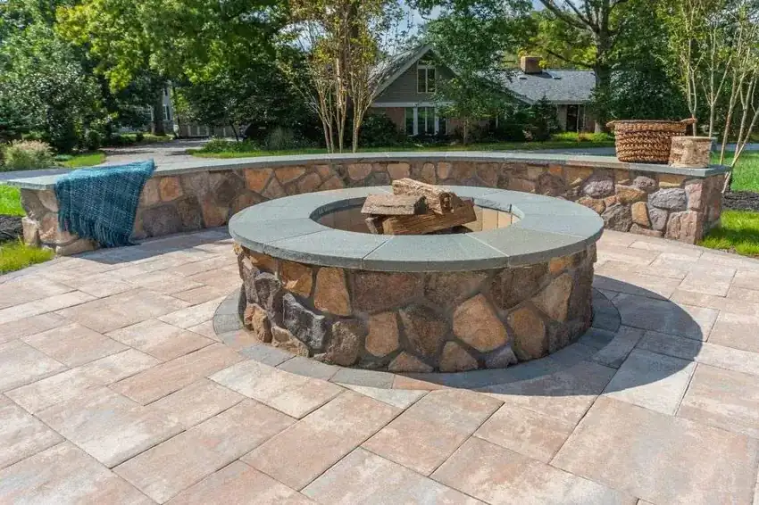 Stone fire pit and paver patio in a Northern Virginia backyard