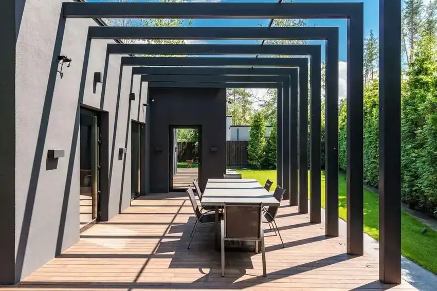 Covered pergola over an outdoor dining area