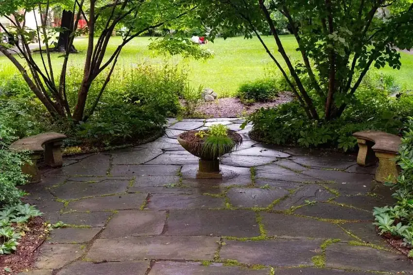 Flagstone courtyard with a center planter